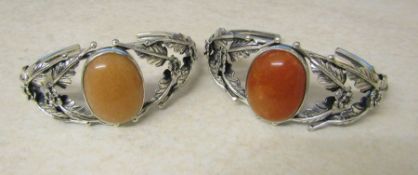 2 white metal and gemstone bangles total weight 81.7 g