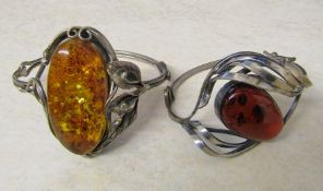 2 silver and amber bangles marked 925 and 800 total weight 57.2 g