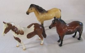 3 Beswick ponies - highland (damage to one ear), Dartmoor warlord and skewbald
