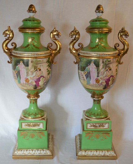 Pair of extremely large late 19th/early 20th century Vienna style lidded vases in a green ground