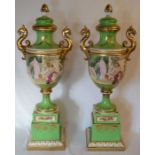 Pair of extremely large late 19th/early 20th century Vienna style lidded vases in a green ground