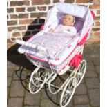 Dolls pram with a Ashton Drake doll