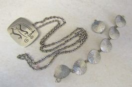 Jorgen Jensen pewter pendant marked 163 with white metal chain and a Jorgen Jensen pewter bracelet