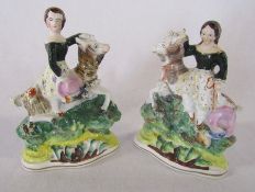 Pair of Staffordshire flatback figures of children / young girls riding goats possibly with some