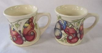 2 Moorcroft 'butterfly' pattern mugs H 8.5 cm