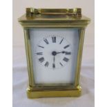 Brass carriage clock (height excluding handle 11 cm ) (damage to back pane of glass)