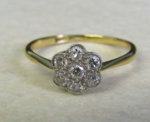 9ct gold (minimum - hallmarked indistinguishable) and platinum diamond daisy ring size O/P weight