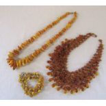 2 amber necklaces L 67 cm and 46 cm and a silver and  amber bracelet with safety chain
