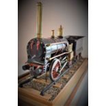 Scale model in a glass case of Robert Stephenson's locomotive 'Northumbrian' built in 1830 to run on