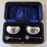 Cased pair of silver salts Chester 1915 (spoons 1913), maker Barker Brothers, weight 5.48 ozt