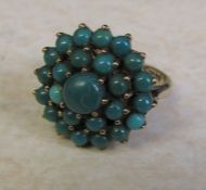 9ct gold turquoise cluster ring, size J/K, hallmarked London 1979, total weight 5.1 g