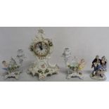 Sitzendorf floral encrusted clock, pair of cherub candelabra and Unter Weiss Bach figural group