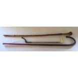 Glass candy cane walking stick, wooden walking stick and a riding crop