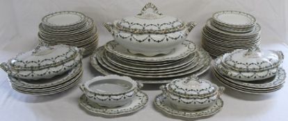 Keeling & Co green and gilt part dinner service retailed by Maple & Co, approximately 70 pieces