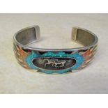 Solid silver cuff bracelet depicting galloping horses inlaid with gemstone flame design D 7 cm