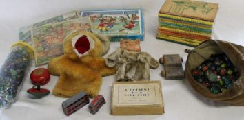 Selection of children's vintage toys including wooden jigsaws & marbles