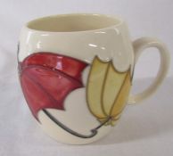 Moorcroft 'umbrella' pattern mug H 9.5 cm