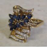Tested as 14ct gold (marked 14k) sapphire and diamond ring, with 13 marquise cut sapphires 4 x 2.