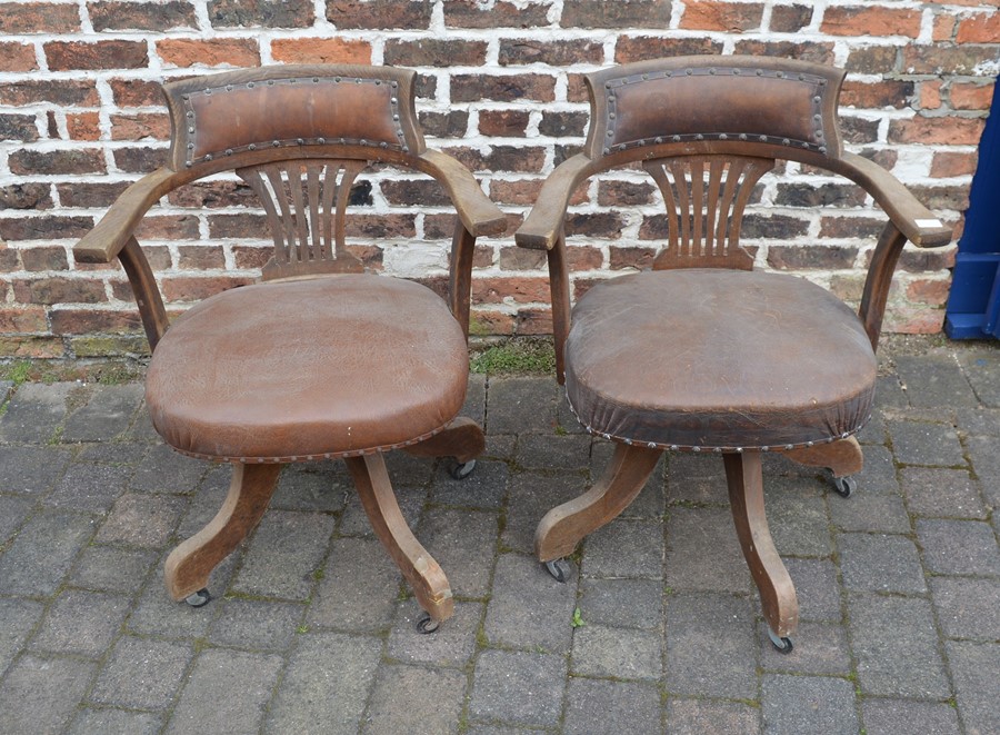 2 early 20th century captain's swivel chairs