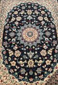 Fine woven full pile rug with black field & floral medallion 150cm x 100cm