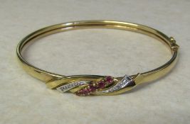 9ct gold ruby and diamond chip bracelet, weight 7.1 g, D 6 cm