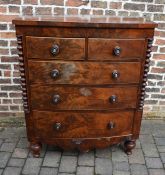 Victorian bow fronted chest of drawers with flame mahogany veneer, turned columns & mother of