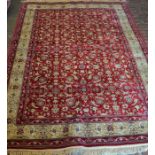 Rich red ground pile cashmere floral carpet with golden border 228cm by 156cm
