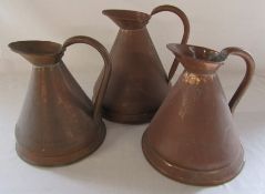 3 large copper jugs (height to top of handle 27 cm, 24 cm and 23 cm)