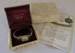 Gents Bulova gold plated wristwatch with elasticated strap complete with box and paperwork, case