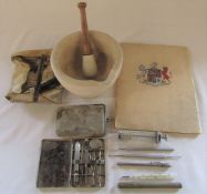 Selection of veterinarian equipment inc sewing kit, syringe, pestle and mortar & commemorative