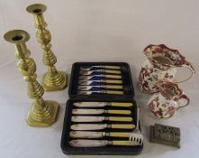 Cased set of fish knives and forks, pair of brass candlesticks, 2 Masons jugs etc