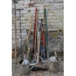 Various gardening & other tools including watering cans, rakes, spades, bolt cutters etc