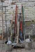 Various gardening & other tools including watering cans, rakes, spades, bolt cutters etc