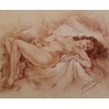 Two gilt framed red and white chalk drawings of reclining female nudes signed Yves Diey (French