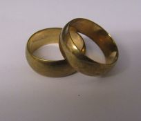 2 9ct gold band rings size T and S, D 7 mm and 6 mm, weight 11.1 g