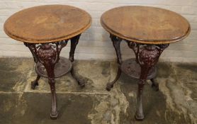 Pair of period pub tables on cast iron bases