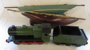 2 handmade pond yachts L 76 cm and 87 cm and a handmade wooden locomotive L 80 cm