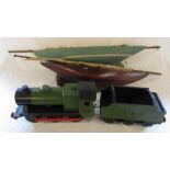 2 handmade pond yachts L 76 cm and 87 cm and a handmade wooden locomotive L 80 cm