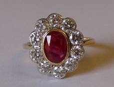 18ct gold ruby and diamond cluster ring, with central 1.0ct ruby, surrounded by approximately 1.50ct
