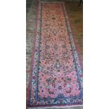 Pink ground Iranian hand woven runner with all over floral pattern 307cm by 81cm