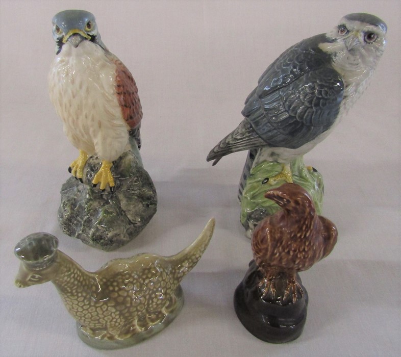 4 Beswick whisky decanters - Merlin (Beneagles full) H 17 cm, Kestrel, small eagle and Loch Ness