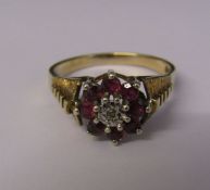 9ct gold ruby and diamond cluster ring size T, total weight 4.02 g