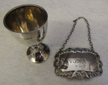 Silver 'Vodka' drinks / decanter label London 1968 weight 0.43 ozt and a small silver cup  / egg cup