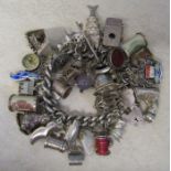 Silver charm bracelet with large quantity of silver and white metal charms total weight 5.63 ozt /