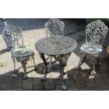 Cast metal garden table and three chairs