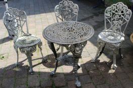 Cast metal garden table and three chairs