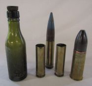 4 shell cases inc WWI and a Sheffield bottle