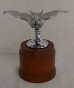 Swift car mascot on a mahogany base Ht 13cm