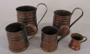 5 copper graduated measuring jugs (tallest 11.5 cm excluding handle)