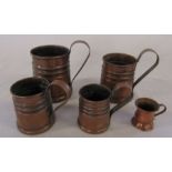 5 copper graduated measuring jugs (tallest 11.5 cm excluding handle)